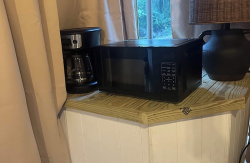 Mentone RV Rental | Mentone glamping getaway in a private screened in cabin in charming Mentone