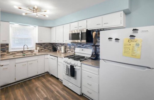 North Central Omaha House | Modern 4BR Duplex Near Dodge, Garage, Fenced Yard, EV Charger, W/D