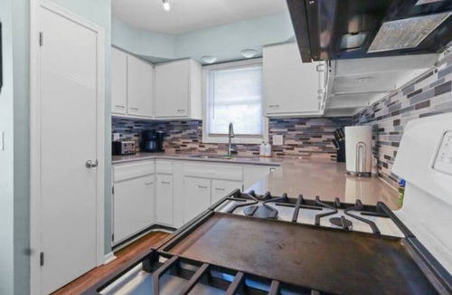 North Central Omaha House | Modern 4BR Duplex Near Dodge, Garage, Fenced Yard, EV Charger, W/D