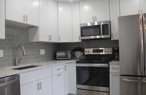 Village Green House | Modern Getaway within walking distance to the harbor!