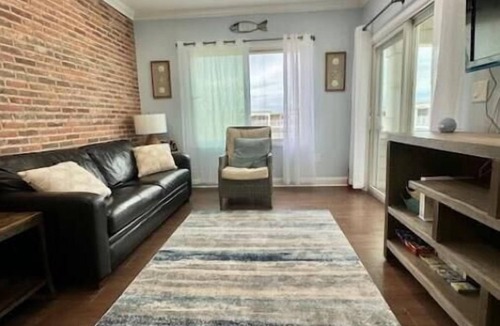 Normandy Beach Condo | Newly Renovated, Beachfront Family Oasis with Private Guarded Beach and Pool