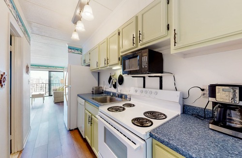 North Ocean City Condo | Partial Ocean View Condo w/Balcony, AC, W/D & Shared Pool - Steps to the Beach