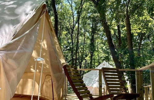 Gentry RV Rental | Peaceful Glamping Tents with Elevated Decks, Cozy Fire Pit, and Secluded Forest Views Near Gentry, AR