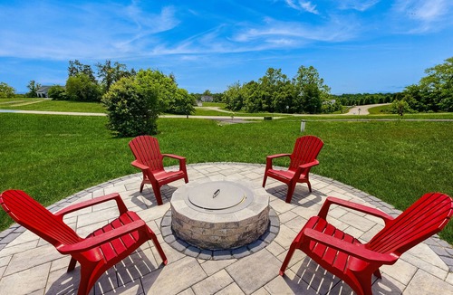 Orange House | Peaceful retreat with hot tub, fire pit, games, kayaks, and water view
