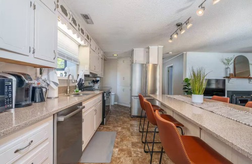 Killen House | Pet Friendly Waterfront Home + Arcade, Peloton, Boathouse, Spacious Lawn + Views