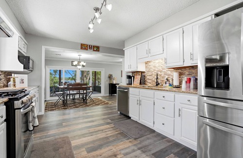 Wagoner House | Private Lakeside Cabin w/2-Slip Dock, Swim Deck, Hot Tub, & Screened Patio