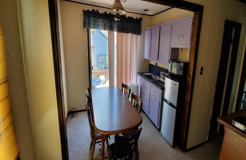 Surf City House | Quaint House Steps To The Beach with great backyard space for outside dining