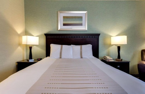 Devils Lake Hotel | Queen Bed Suite near Roosevelt Park | Free Parking & Year-Round Pool Access!