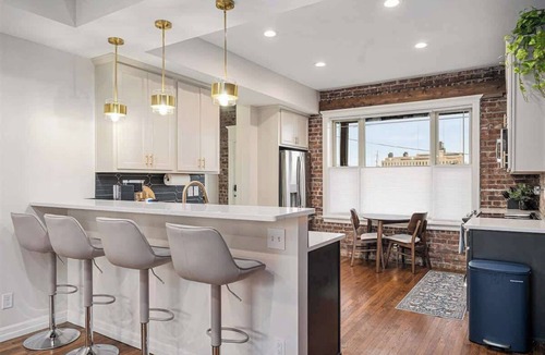 Downtown Omaha House | Rare Omaha Brownstone Retreat! 2 Kings and Garage!
