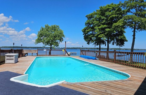 Durants Neck Cottage | Relax on the Little River with a pool, fishing, and river access.