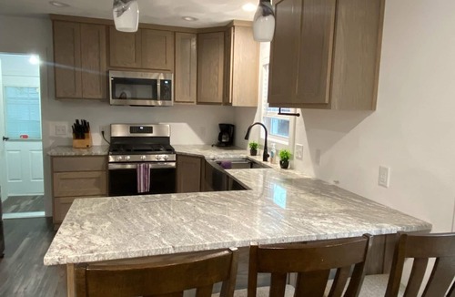 Edgerton House | Remodeled home with pontoon rental 2 decks Private beach playground volleyball