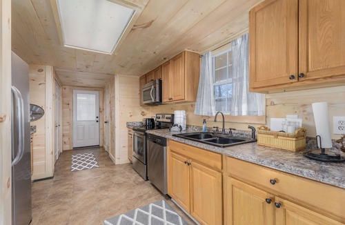 Cosby Cabin | Riverside Cabin w/Fishing, Hot Tub & Firepit