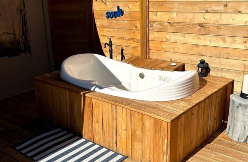 Oatmeal RV Rental | Romantic Hilltop Safari Glamping Tent with Lake Views near Lake Travis in Marble Falls, Texas