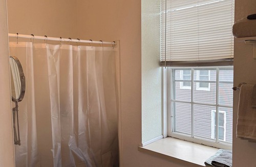 Spillville Apartment | Room 5: Sleep Where Prohibition Secrets Were Made - Historic Escape!