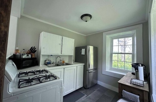 Decorah House | Secluded 1860 Stone House recently remodeled on the Upper Iowa River by Bluffton