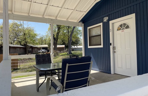 Porum Cabin | Studio cabin #2 with lake view, boat dock access, outdoor seating, and firepit.