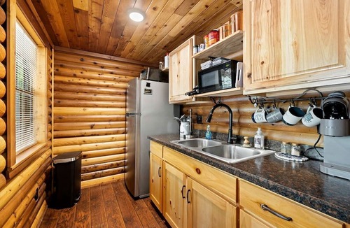 Pickens Cabin | Stunning Riverfront Log Cabin Nestled Amidst Trees in Nashoba, Oklahoma