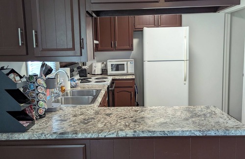 Windsor Heights House | The Cozy Retreat Grt Location Game Room Outdoor Fun and Relaxation.
