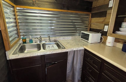 Pineville Cabin | The Little Sugar Shack rustic tiny cabin with private hot tub sunset star views