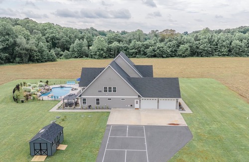 Denton House | The Wilder Way with a beautiful pool, hot tub, and a pickleball court!