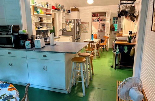 Scandia House | This historic 1911 summer cabin set along the saint croix river offers a quiet step back in time. Filled with original character, the home features a cozy fireplace, screened porches with sweeping river views. Simple, serene and surrounded by nature.