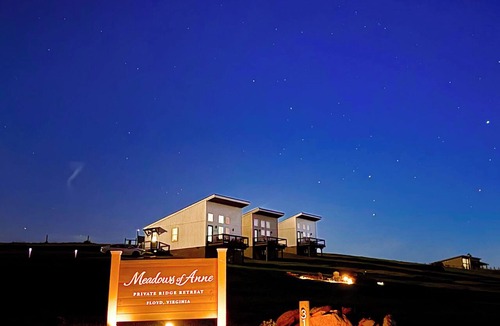Court House Apartment | Thoughtfully designed two-bedroom retreat in Floyd, Virginia featuring mountain views, a private deck, full kitchen, and shared fire pit access just minutes from downtown Floyd.