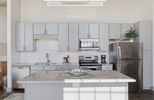 Converse Apartment | Top Floor River View, Historic Mill Loft, Sleeps 6