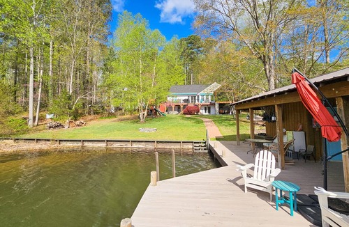 Bumpass House | Tranquil lakefront retreat with hot tub, screened porch, kayaks, and more