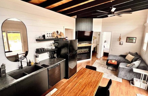 East Dubuque Cabin | Trendy 2-bedroom floating cabin on river backwaters with HOT TUB!