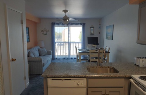 North Ocean City Condo | Two-level condo with balcony, AC, pool & dock - blocks to beach/Northside Park