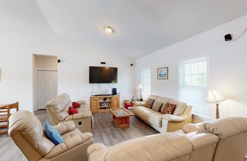 Orange House | Two-story, lakefront getaway with dock, beach, grill, 2 kayaks, 2 canoes, AC