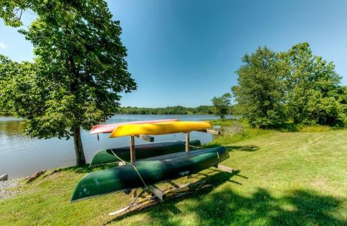 Orange House | Two-story, lakefront getaway with dock, beach, grill, 2 kayaks, 2 canoes, AC