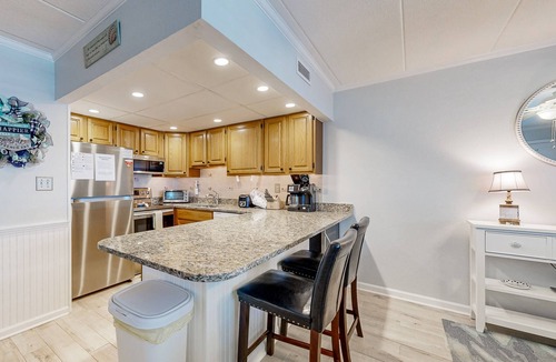 Midtown Ocean City Condo | Updated ocean-view condo with beach access, patio, central AC & washer/dryer