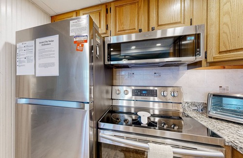 Midtown Ocean City Condo | Updated ocean-view condo with beach access, patio, central AC & washer/dryer