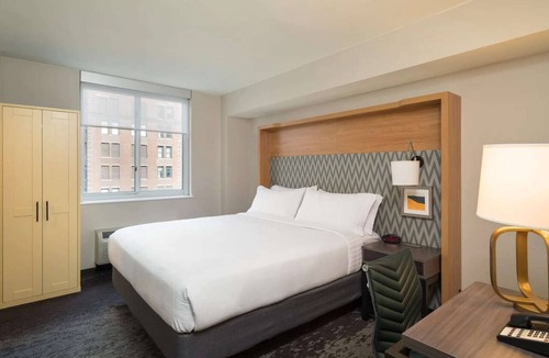 Financial District Hotel | Walk to One World Trade + Fitness Room & Wi-Fi
