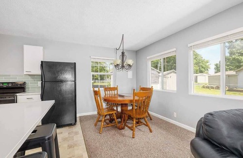 Newaygo Cottage | Waterfront Suite Dock, Kayaks, Firepit, BBQ