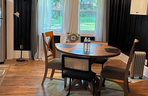Toddville Road House | West side gem on a half-acre lot. Sunroom for indoor/outdoor living. Book today!