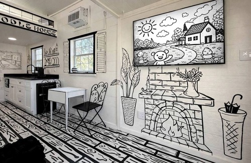Paige Cabin | Whimsical Lakefront Tiny Home with Hand-Drawn Doodle Design Near Bastrop, Texas