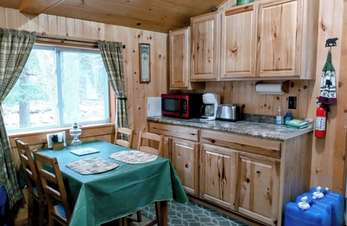 Woodsville Cabin | White Mountain scenic river camp with cozy cabin & comfy RV