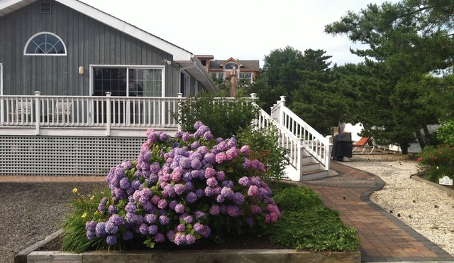200 feet to the ocean on a private lane sits this wonderful 4 bedroom ranch