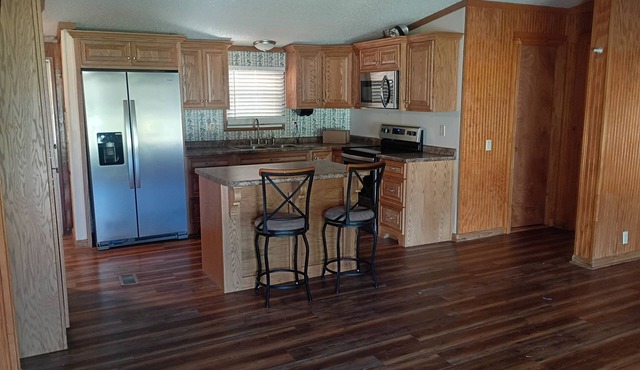 3-Bedroom 2-bath Home – Covered Porch & Deck, Fenced front Yard, Carport, AC!”