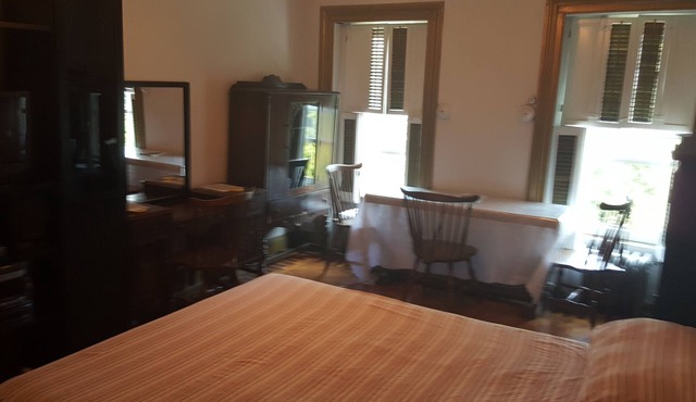 BEDROOM # 1 WITH AN EVENT SPACE AND BACK PORCH
