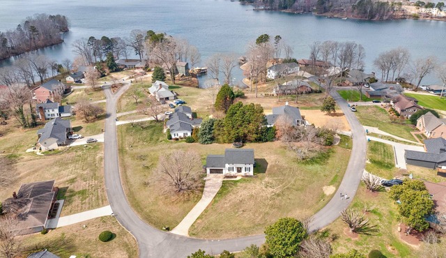 Charming house in a golf course community with lake views and a big yard.