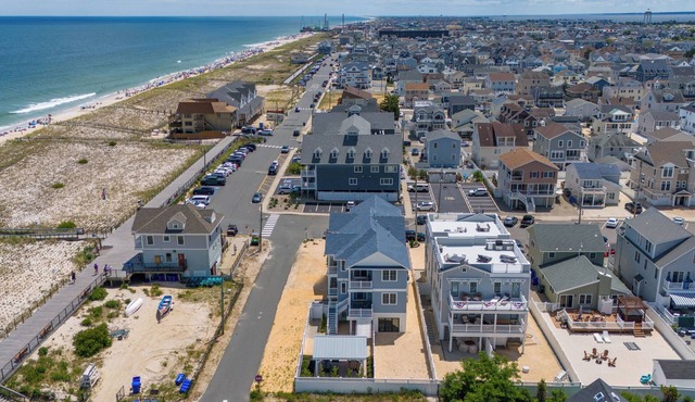 FAMILY TIDES - sweeping ocean views from a 4 BR home -steps from beach and shops