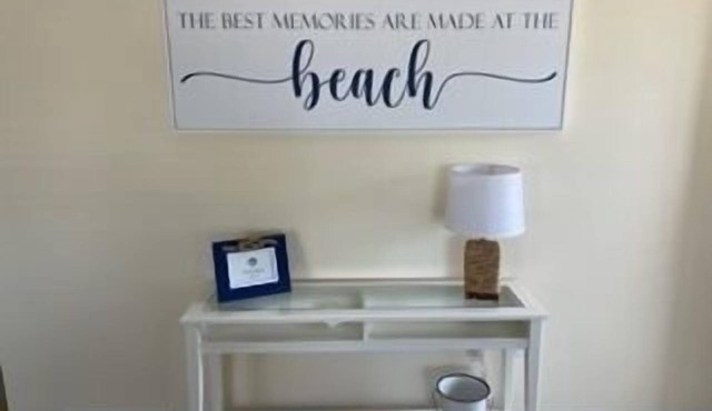 First floor three bedroom, two full bath unit two blocks from the beach