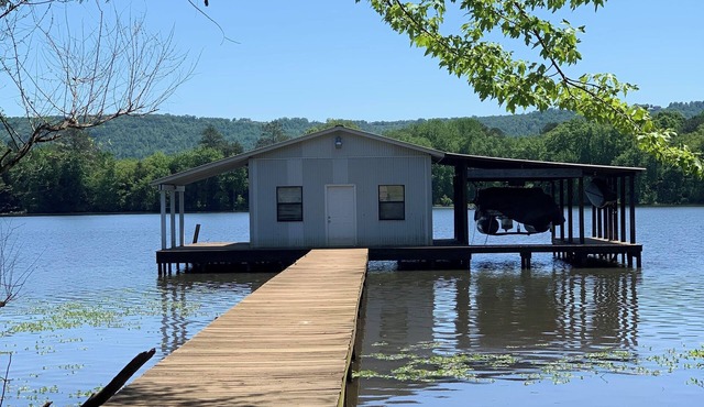 Lake side apartment with shared 100’ pier and pavilion with rock BBQ pit.