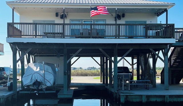 Located on Private Canal 411 Lake Breeze in Hackberry