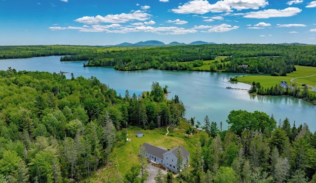 Oceanfront, mobility-minded home: dock, kayaks, views, hot tub, fire pit + games in Lamoine
