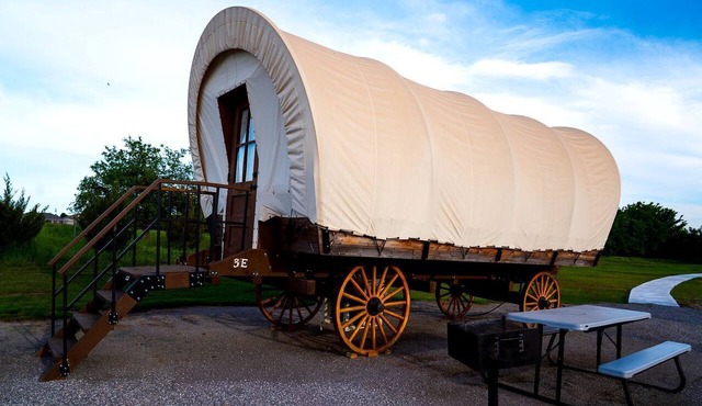Perfect Glamping Vacations in this Rustic Conestoga Covered Wagon Rental in Oklahoma