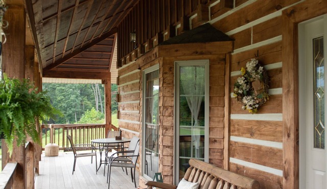 Rustic Log Lodge Overlooking Water and Mountain Views